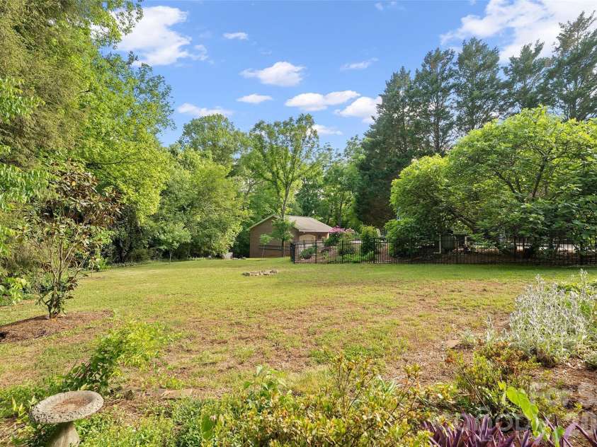 602 Main Street, Davidson, NC 28036.  MLS# CAR4376651, YatesRealty ID 20788. Private Level Backyard with Fenced in-ground pool