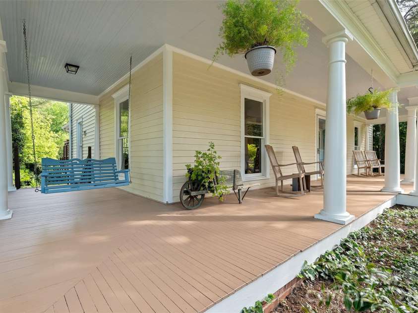 602 Main Street, Davidson, NC 28036.  MLS# CAR4376651, YatesRealty ID 20788. Timeless two-story Colonial Revival featuring a wraparound porch with classical columns and a pedimented entry. Ideally located just steps from Davidson College and all that downtown Davidson has to offer.