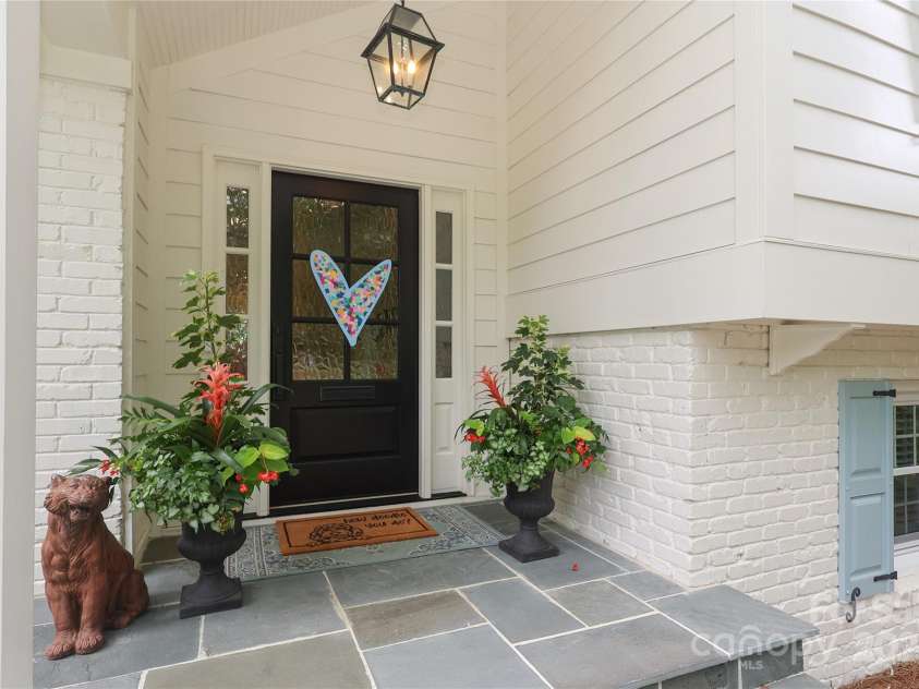 4126 Tyndale Avenue, Charlotte, NC 28210.  MLS# CAR4268563, YatesRealty ID 20792. Beautiful front porch with carolina blue stone, new custom front door and updated lighting