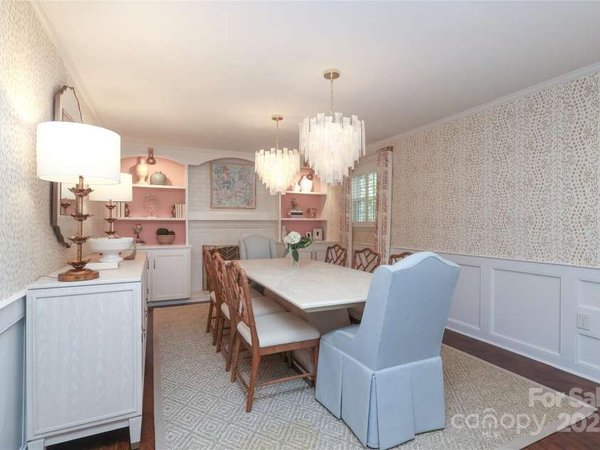 4126 Tyndale Avenue, Charlotte, NC 28210.  MLS# CAR4268563, YatesRealty ID 20792. Charming lower level dining room with custom builts in and fireplace