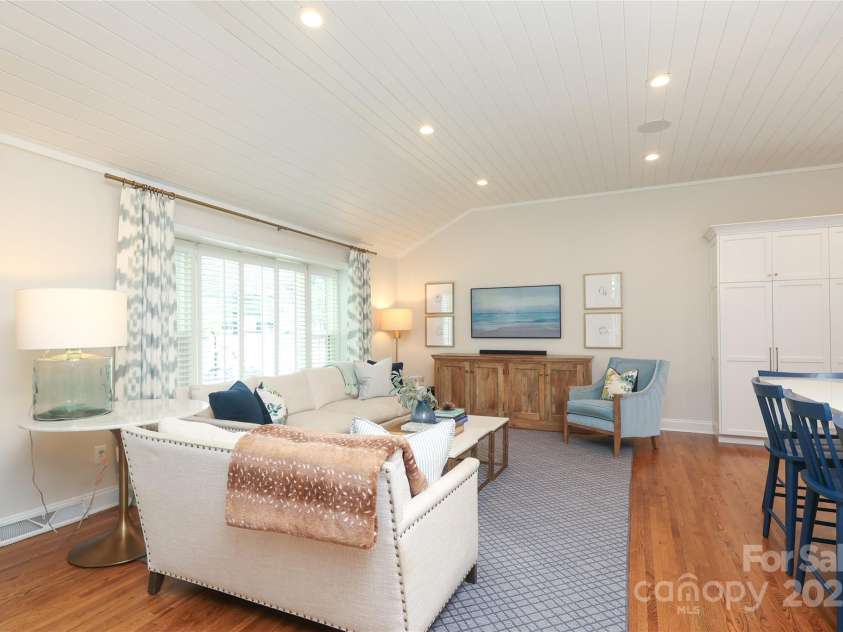 4126 Tyndale Avenue, Charlotte, NC 28210.  MLS# CAR4268563, YatesRealty ID 20792. Frst floor living space with a partially vaulted shiplap ceiling and adjoins a beautiful updated kitchen
