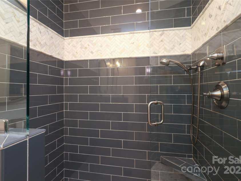 4126 Tyndale Avenue, Charlotte, NC 28210.  MLS# CAR4268563, YatesRealty ID 20792. Large walk in shower with dual overhead and handheld shower heads