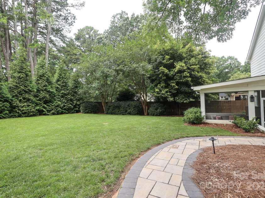 4126 Tyndale Avenue, Charlotte, NC 28210.  MLS# CAR4268563, YatesRealty ID 20792. Lots of green and mature landscaping