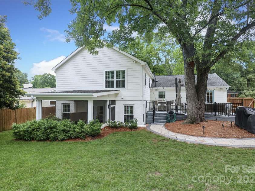 4126 Tyndale Avenue, Charlotte, NC 28210.  MLS# CAR4268563, YatesRealty ID 20792. Rear view of the home with large flat back yard