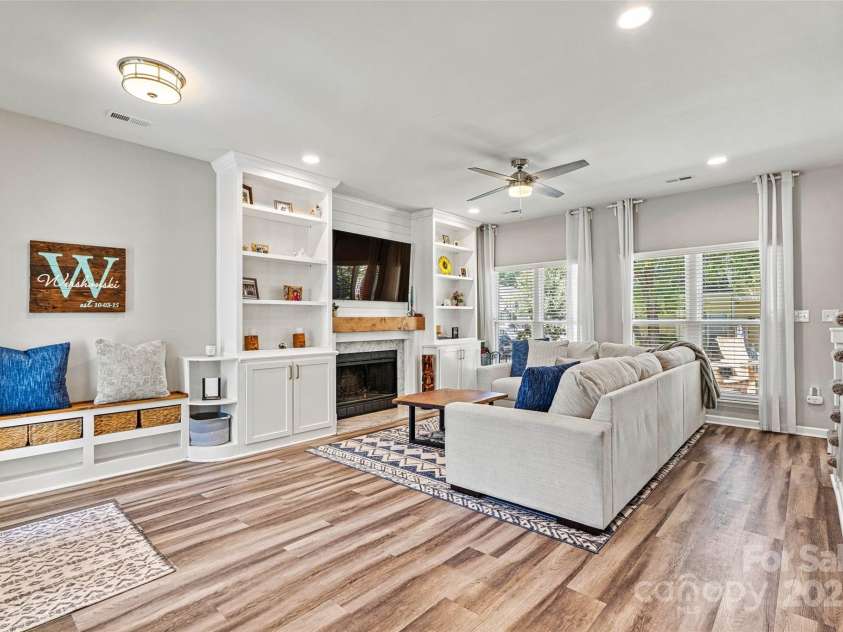 103 Claremont Way, Mooresville, NC 28117.  MLS# CAR4245647, YatesRealty ID 20798. Custom Built ins surround the cozy wood burning fireplace.