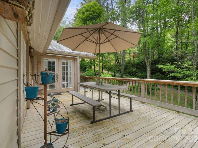 80 Laurel Canyon Road, Franklin, NC 28734.  MLS# CAR4270579, YatesRealty ID 20799. Big Wraparound Deck (this is off of the dining area)