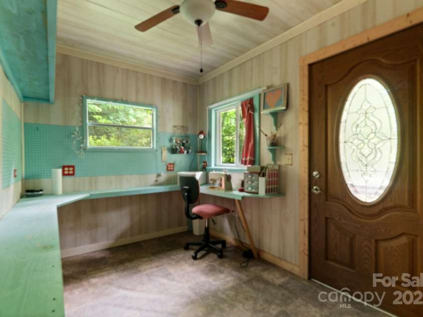 80 Laurel Canyon Road, Franklin, NC 28734.  MLS# CAR4270579, YatesRealty ID 20799. Ceiling Fan and Work Area in She-Shed/Workshop