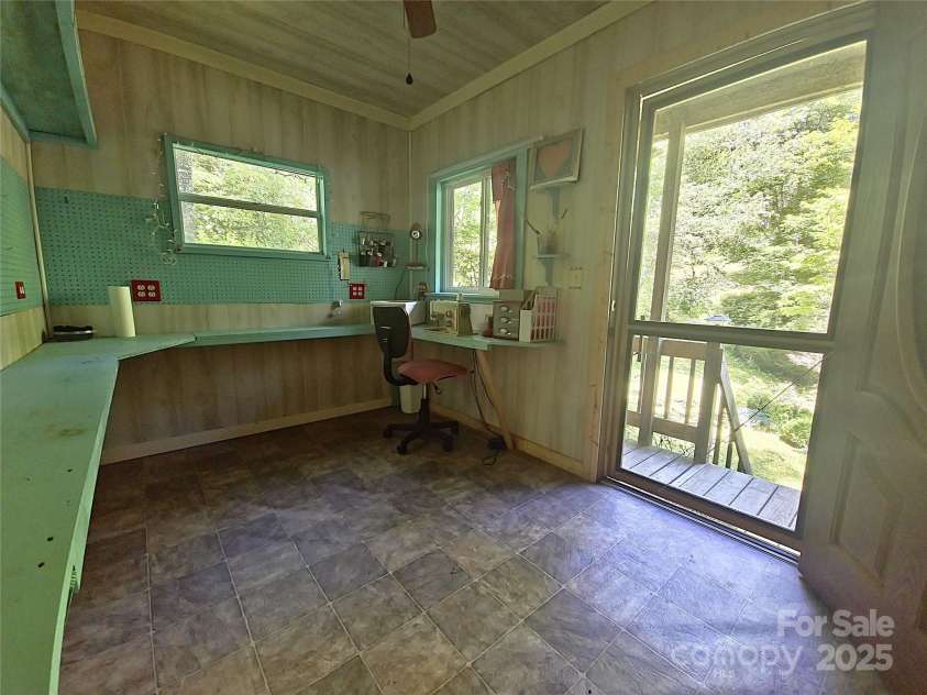 80 Laurel Canyon Road, Franklin, NC 28734.  MLS# CAR4270579, YatesRealty ID 20799. Ceiling Fan and Work Area in She-Shed/Workshop