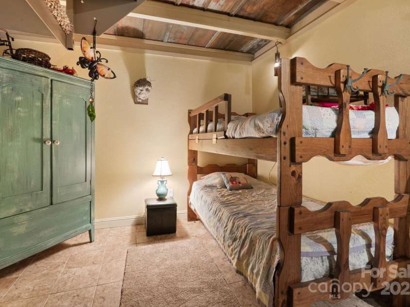 80 Laurel Canyon Road, Franklin, NC 28734.  MLS# CAR4270579, YatesRealty ID 20799. Lower-Level Rec Room Bunk Area