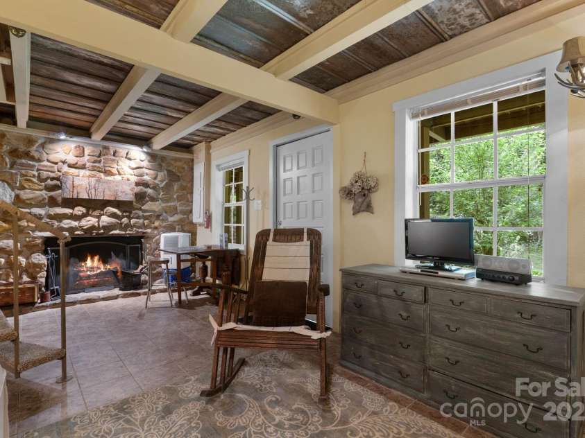 80 Laurel Canyon Road, Franklin, NC 28734.  MLS# CAR4270579, YatesRealty ID 20799. Lower-Level Rec Room with Bunk Area & Fireplace