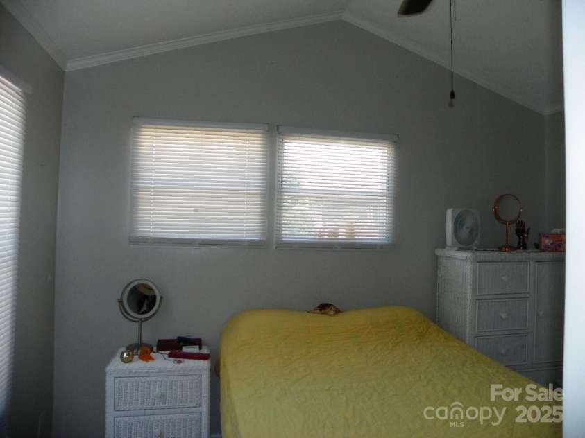 166 Eagle Drive, New London, NC 28127.  MLS# CAR4271205, YatesRealty ID 20800. Bedroom with ceiling fan.