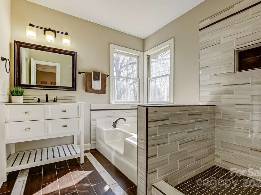 7306 Timbercreek Court, Denver, NC 28037.  MLS# CAR4231186, YatesRealty ID 20806. Primary bedroom ensuite bathroom featuring a separate shower and tub.