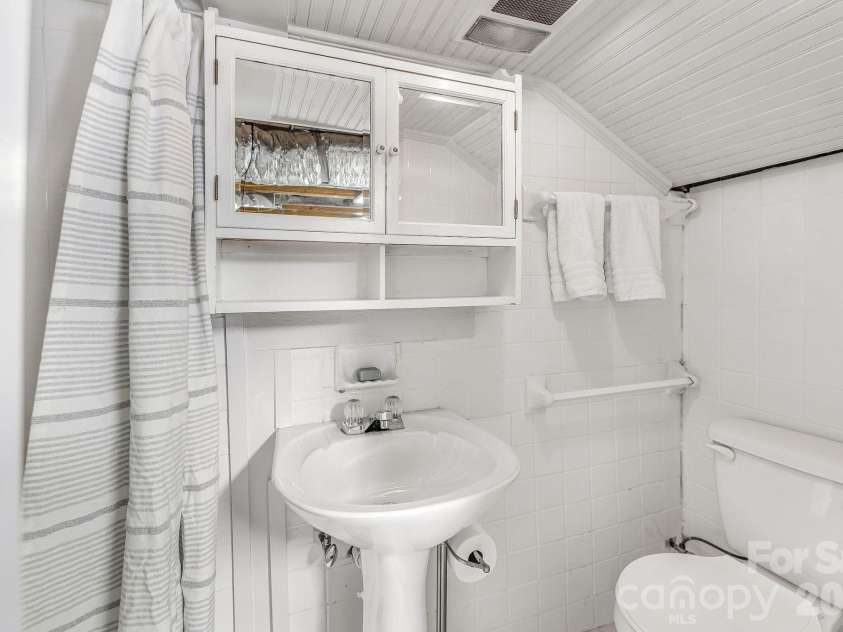 22 Westover Drive, Asheville, NC 28801.  MLS# CAR4376355, YatesRealty ID 20815. Lower Level Bathroom