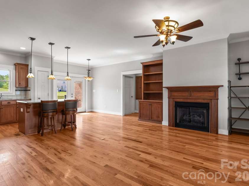2411 Carriage Lane, Lincolnton, NC 28092.  MLS# CAR4369152, YatesRealty ID 20821. Where everything comes together… kitchen, living space, and a fireplace that makes it feel like home.