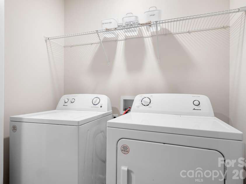 3939 Townes Boulevard, Terrell, NC 28682.  MLS# CAR4380268, YatesRealty ID 20824. Laundry room with upper shelf (washer and dryer included)