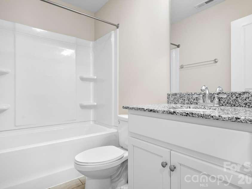 3939 Townes Boulevard, Terrell, NC 28682.  MLS# CAR4380268, YatesRealty ID 20824. Second Floor hall bathroom with granite countertops