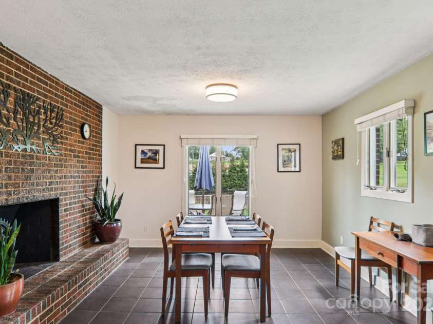 318 Old Leicester Highway, Asheville, NC 28806.  MLS# CAR4261061, YatesRealty ID 20828. Dining Area w Fireplace