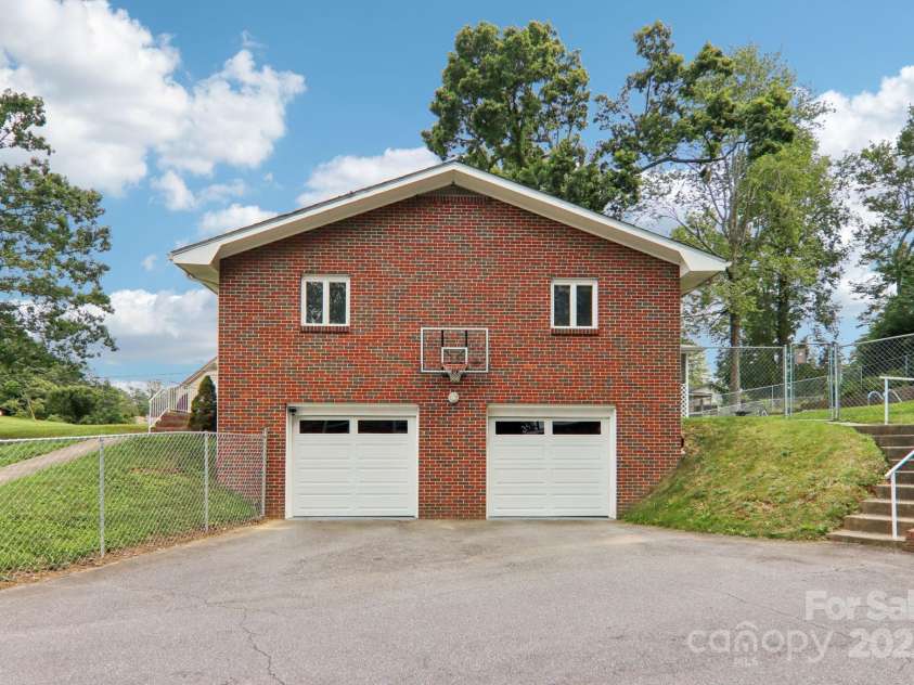 318 Old Leicester Highway, Asheville, NC 28806.  MLS# CAR4261061, YatesRealty ID 20828. Downstairs Garage Entrance