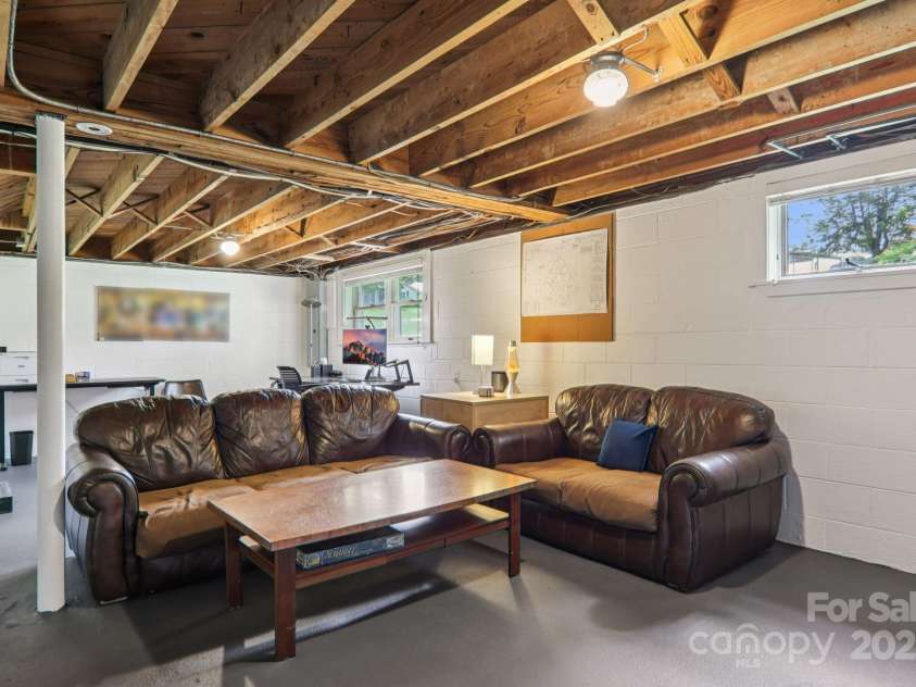318 Old Leicester Highway, Asheville, NC 28806.  MLS# CAR4261061, YatesRealty ID 20828. Partially Finished Basement Area