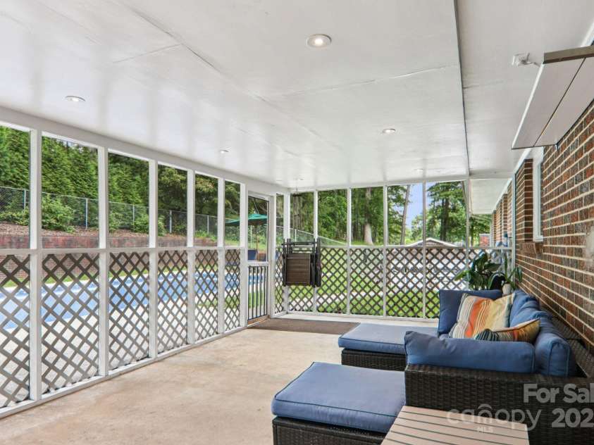 318 Old Leicester Highway, Asheville, NC 28806.  MLS# CAR4261061, YatesRealty ID 20828. Screened Porch Near Pool