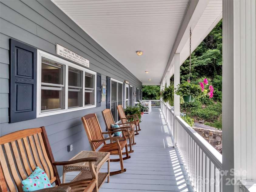 28 Mountain Breeze Drive, Maggie Valley, NC 28751.  MLS# CAR4271261, YatesRealty ID 20838. Fabulous Covered Porch