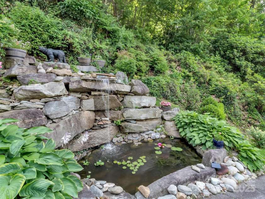 28 Mountain Breeze Drive, Maggie Valley, NC 28751.  MLS# CAR4271261, YatesRealty ID 20838. Fountain with a Goldfish Pond