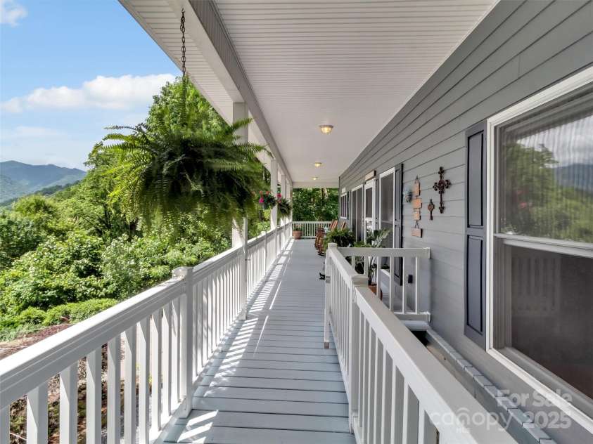 28 Mountain Breeze Drive, Maggie Valley, NC 28751.  MLS# CAR4271261, YatesRealty ID 20838. Relax on the Porch Overlooking the VIEWS