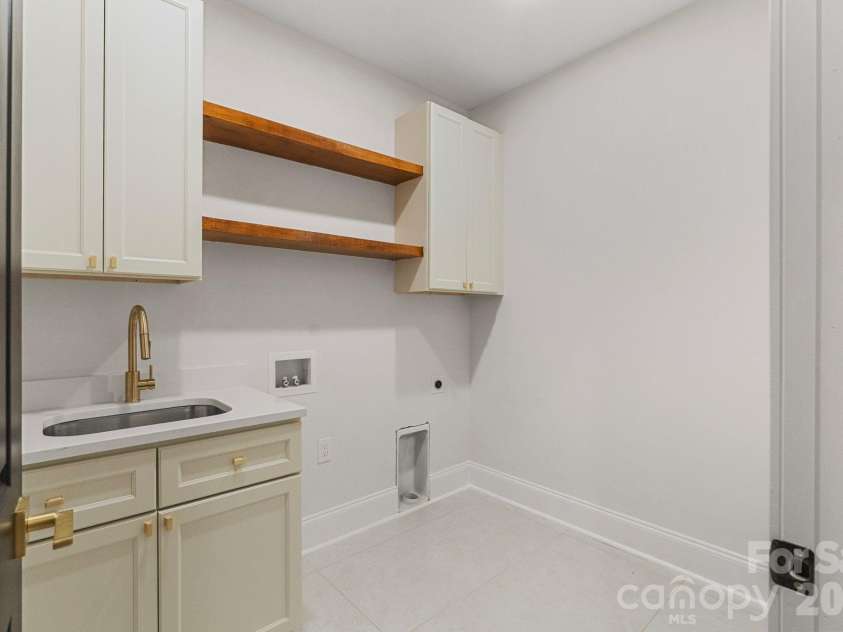 3204 Chancellor Lane, Monroe, NC 28110.  MLS# CAR4376911, YatesRealty ID 20840. Laundry room