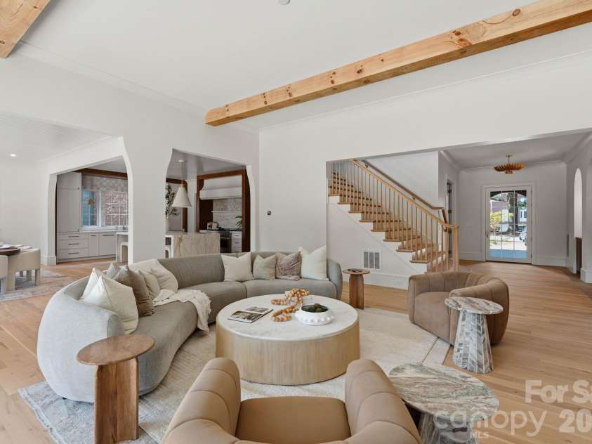 110 Hunter Lane, Charlotte, NC 28211.  MLS# CAR4424085, YatesRealty ID 20843. Living Room - Solid Wood Beams - Front entry is to the right