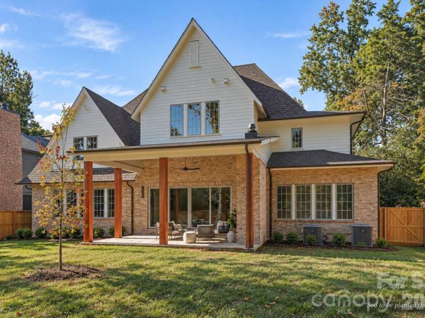 110 Hunter Lane, Charlotte, NC 28211.  MLS# CAR4424085, YatesRealty ID 20843. Rear / South Elevation - Covered Lanai with Wood Burning Fireplace
