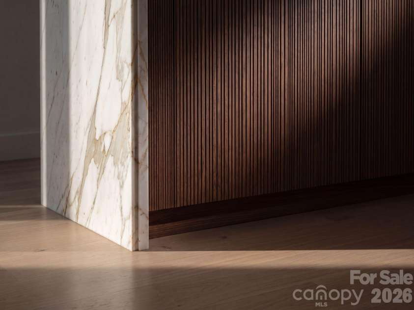 110 Hunter Lane, Charlotte, NC 28211.  MLS# CAR4424085, YatesRealty ID 20843. Reeded cabinet doors, marble waterfall edge profile
