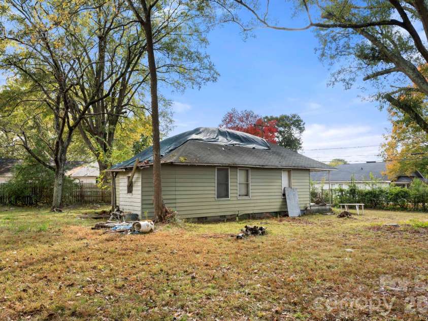 304 Bush Street, Gastonia, NC 28056.  MLS# CAR4377960, YatesRealty ID 20844. Side yard