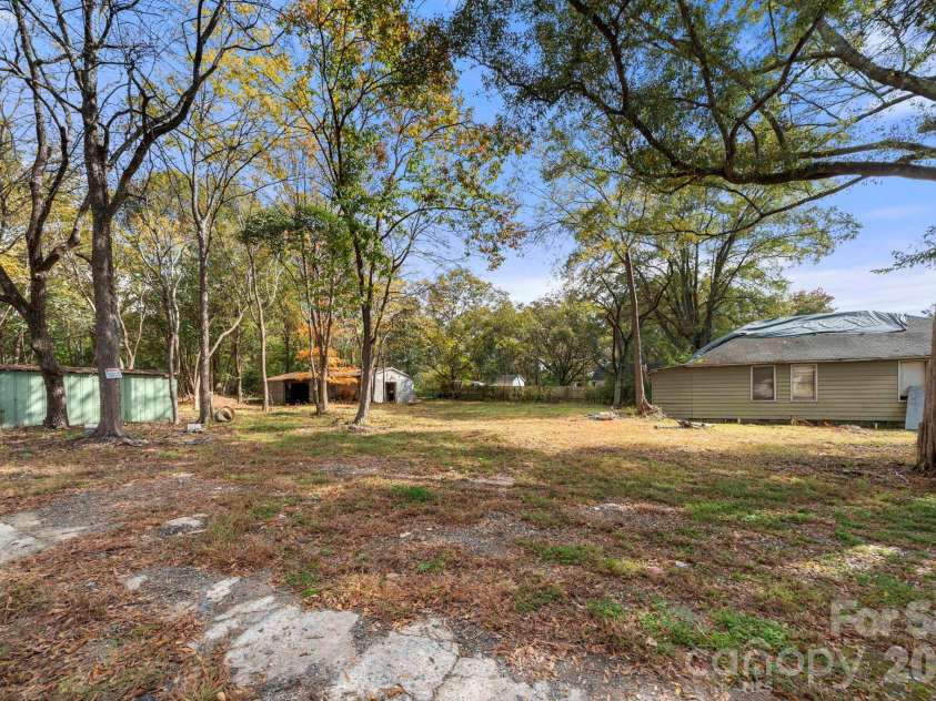 304 Bush Street, Gastonia, NC 28056.  MLS# CAR4377960, YatesRealty ID 20844. View of side yard and back yard