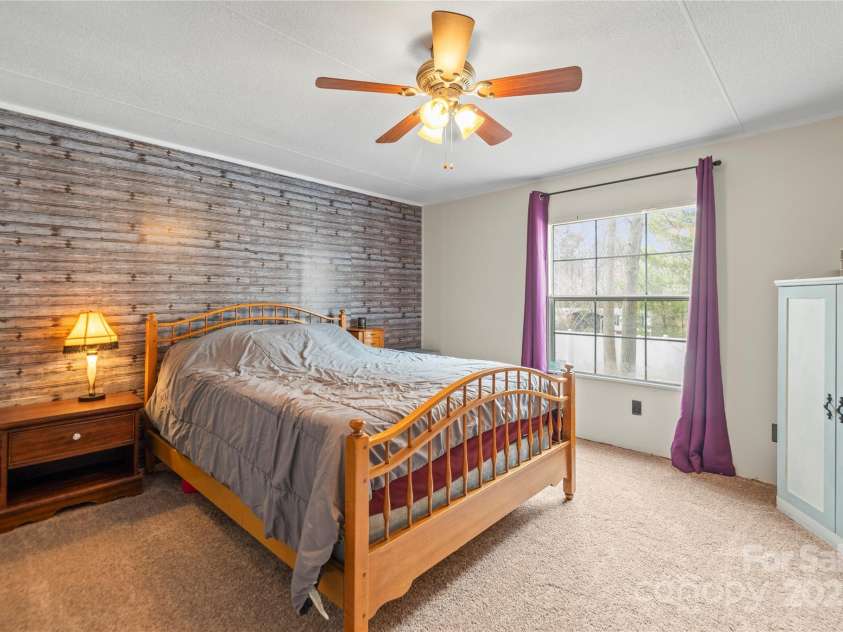 114 Catawba Woods Court, Belmont, NC 28012.  MLS# CAR4210954, YatesRealty ID 2085. Primary room with ceiling fan and new carpet