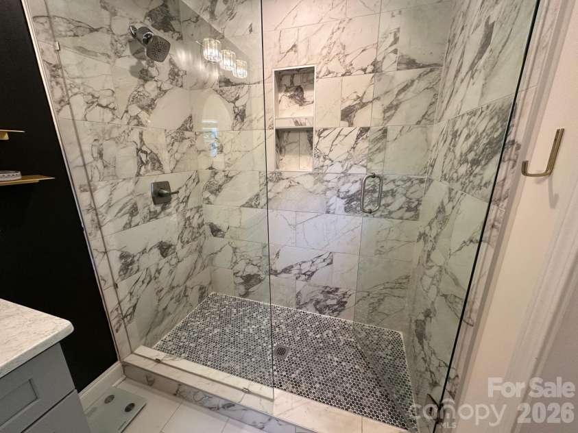 3821 Dunwoody Drive, Charlotte, NC 28215.  MLS# CAR4376800, YatesRealty ID 20850. Primary bath shower