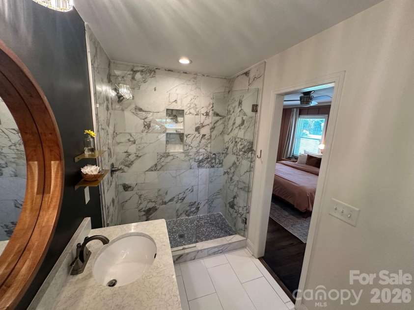 3821 Dunwoody Drive, Charlotte, NC 28215.  MLS# CAR4376800, YatesRealty ID 20850. Primary bath shower area