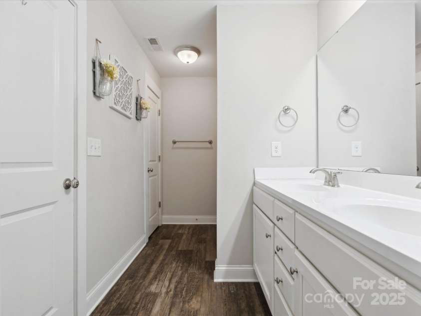 429 Summer Ridge Drive, Stanley, NC 28164.  MLS# CAR4269472, YatesRealty ID 20850. Water closet to left.The shower/tub combination to the right.