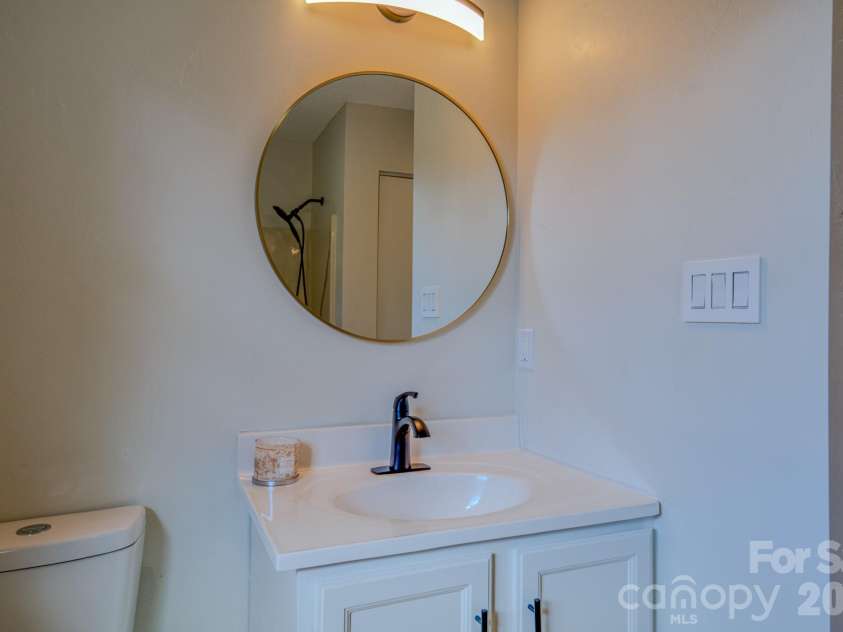 4 Hedgerose Court, Asheville, NC 28805.  MLS# CAR4356558, YatesRealty ID 20859. Bathroom 1 with tasteful modern updates