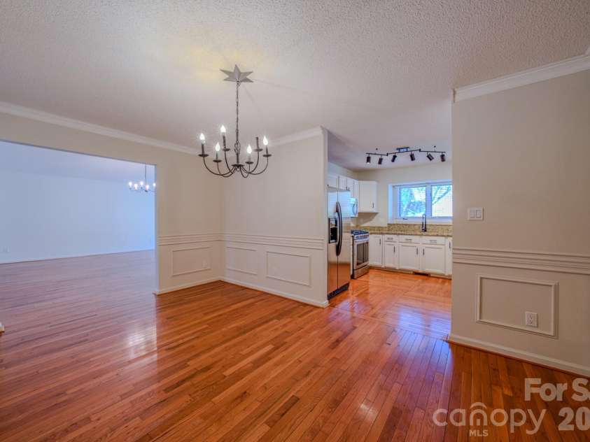 4 Hedgerose Court, Asheville, NC 28805.  MLS# CAR4356558, YatesRealty ID 20859. Dining room feeds into the kitchen seamlessly