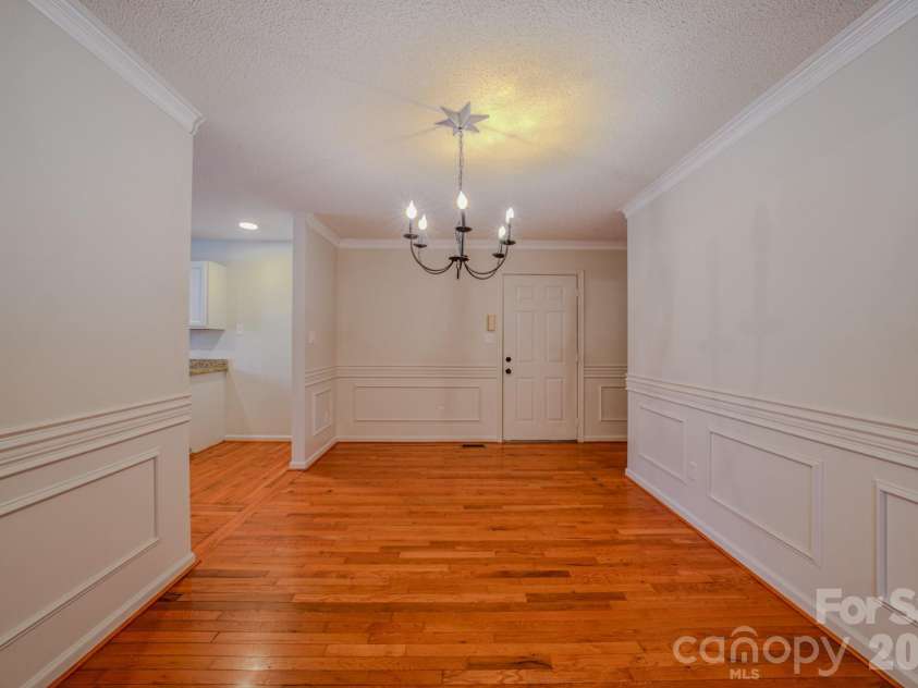4 Hedgerose Court, Asheville, NC 28805.  MLS# CAR4356558, YatesRealty ID 20859. Dining room with chandelier