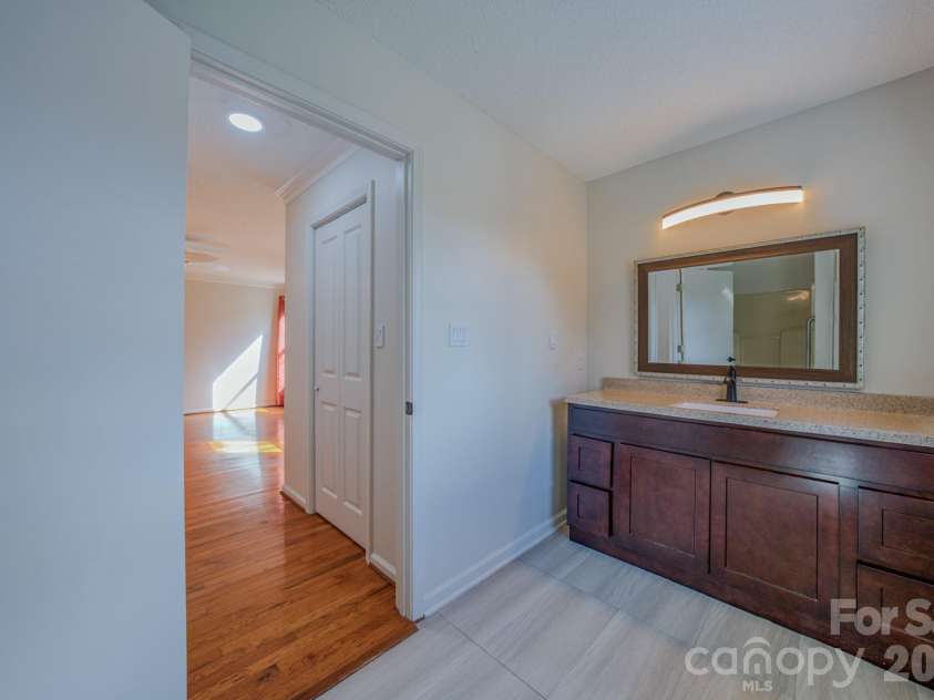 4 Hedgerose Court, Asheville, NC 28805.  MLS# CAR4356558, YatesRealty ID 20859. Primary full bath with newer modern vanity