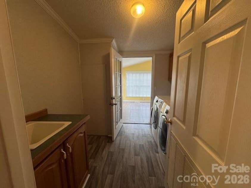 4 English Oaks Drive, Candler, NC 28715.  MLS# CAR4334695, YatesRealty ID 2086. Laundry/Into Sunroom