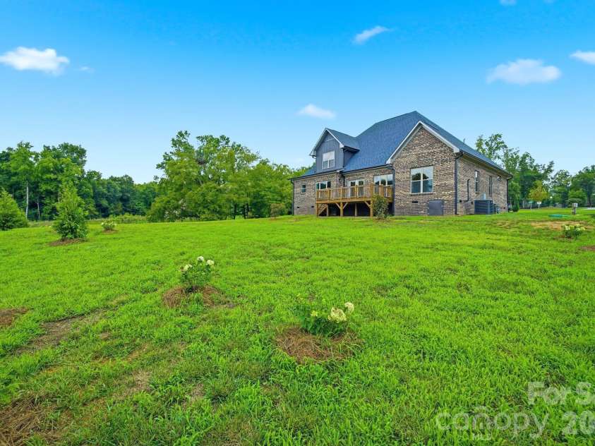 2003 Duntov Drive, Monroe, NC 28110.  MLS# CAR4405457, YatesRealty ID 20871. Large Acre Lot with Privacy Trees