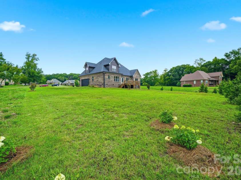 2003 Duntov Drive, Monroe, NC 28110.  MLS# CAR4405457, YatesRealty ID 20871. Large Acre Lot with Privacy Trees