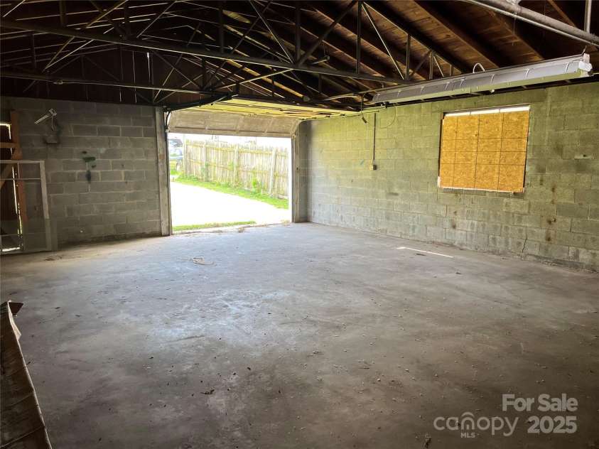 304 Ingram Street, Thomasville, NC 27360.  MLS# CAR4271993, YatesRealty ID 20872. Inside of Storage Shed