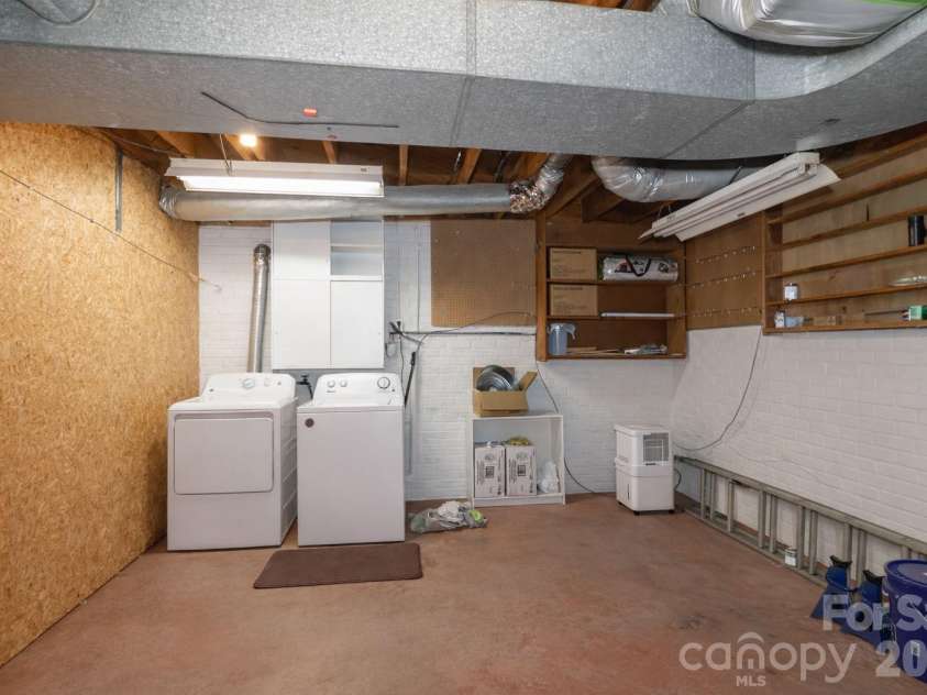 216 31st Avenue, Hickory, NC 28601.  MLS# CAR4349538, YatesRealty ID 20884. Laundry room and unfinished storage