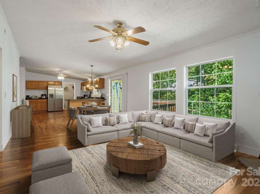 35 Evelyn Acres Drive, Asheville, NC 28806.  MLS# CAR4312401, YatesRealty ID 20886. Loads of natural light in the cozy living room. (virtually staged)