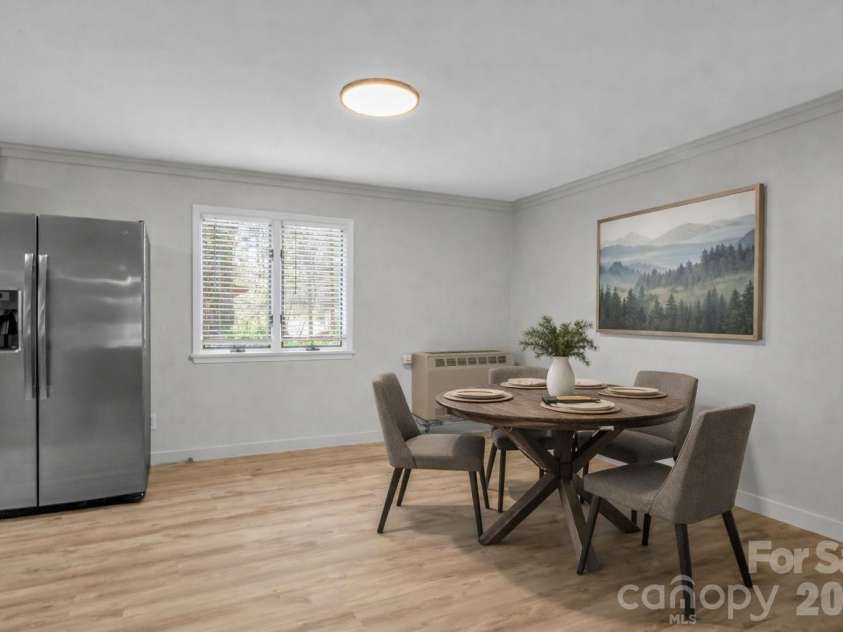 605 Rhododendron Avenue, Black Mountain, NC 28711.  MLS# CAR4367853, YatesRealty ID 20891. Kitchen eating area virtually staged