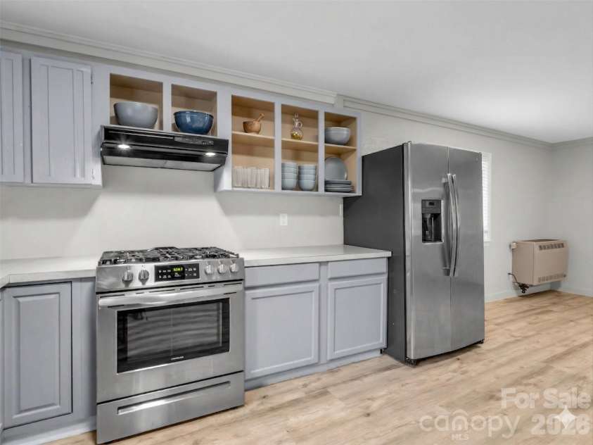 605 Rhododendron Avenue, Black Mountain, NC 28711.  MLS# CAR4367853, YatesRealty ID 20891. Open shelving virtually staged