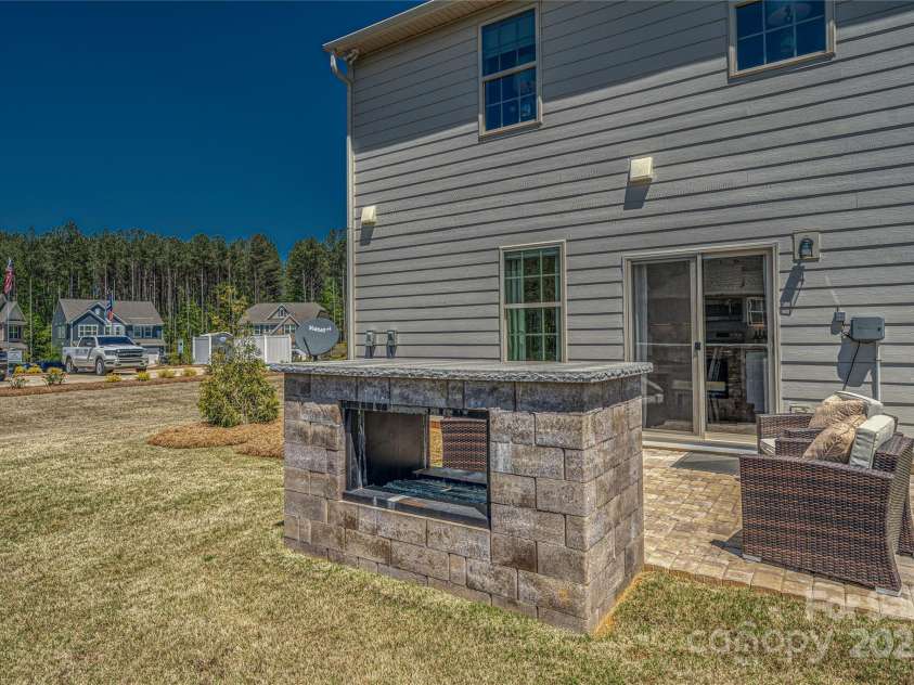 247 Tackle Box Drive, Troutman, NC 28166.  MLS# CAR4250227, YatesRealty ID 20892. Back yard with pavers
